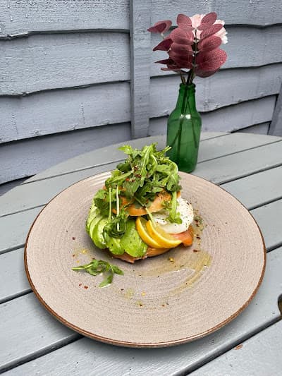 Croissant and cappuccino on a dark table